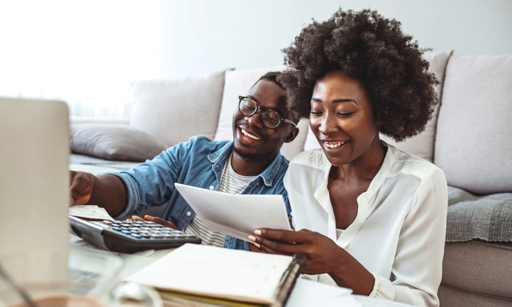 A black african couple doing their budget