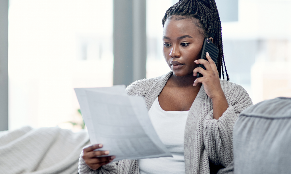 A customer making a call to the bank
