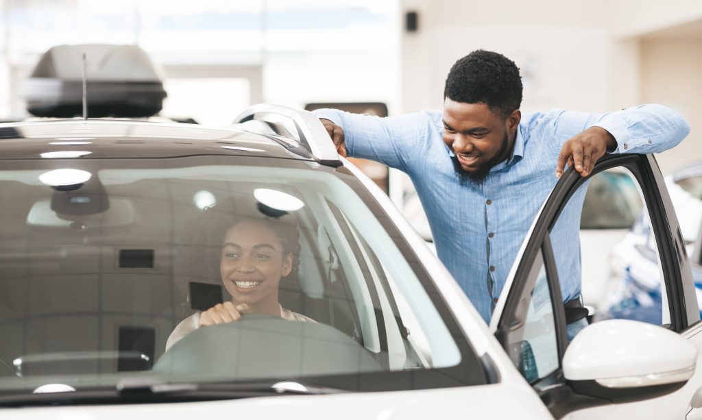 A black african lady purchasing getting her new vehicle